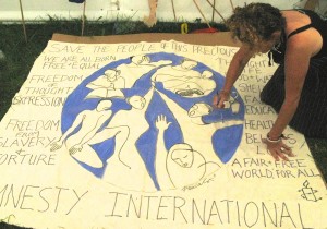 Painting banners for Amnesty at WOMAD festival